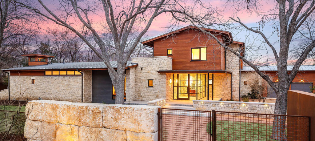 Modern luxury home exterior with clean lines and expansive glass in Dallas, TX