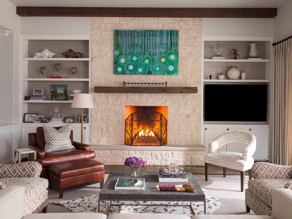 Luxury living room with built-ins and lit fireplace in Dallas, TX
