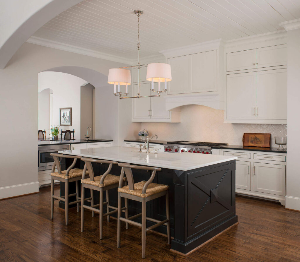 Luxury white kitchen with large island and pendant lighting in Dallas, TX