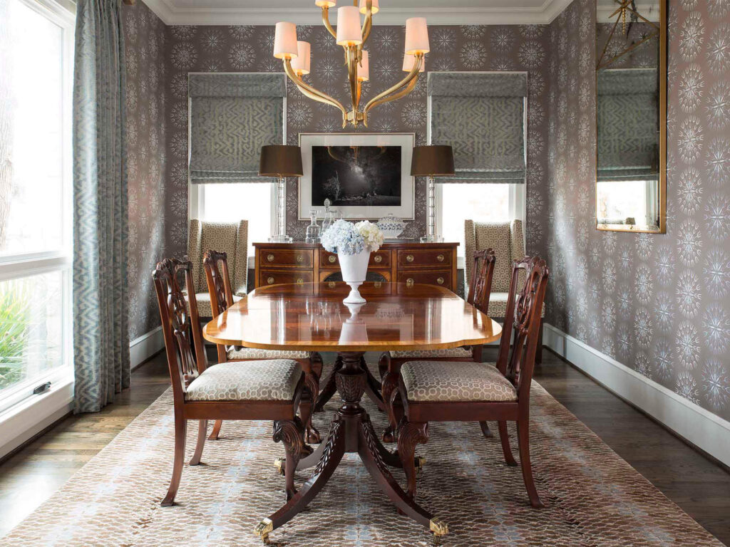 Formal dining room with chandelier and patterned wallpaper in luxury Dallas home