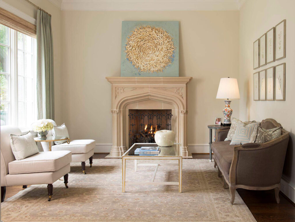 Living room with carved stone fireplace and neutral furnishings in Dallas