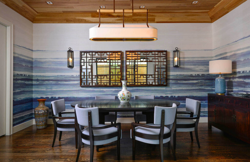 Dining room with statement art wall and contemporary lighting in Dallas, TX