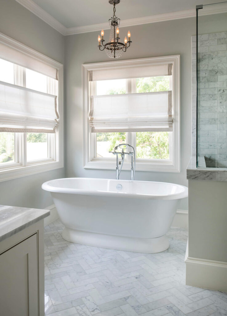 Luxury bathroom with freestanding soaking tub and large windows in Dallas, TX