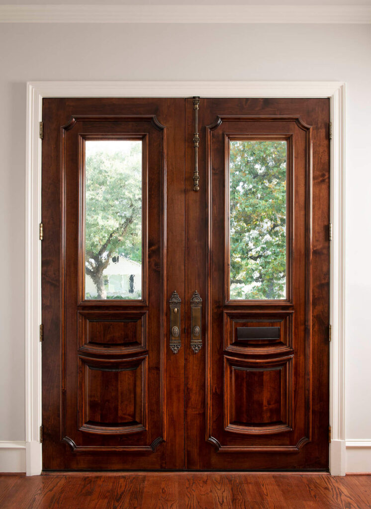 Wood double front entry doors in luxury custom home in Dallas, TX