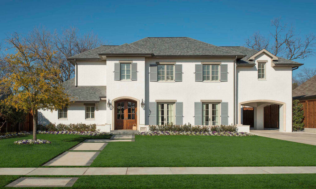 Classic white stucco custom home exterior with symmetrical façade in Dallas, TX