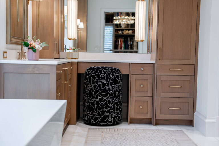Brunswick dual vanity detail with tailored cabinetry in Dallas custom home