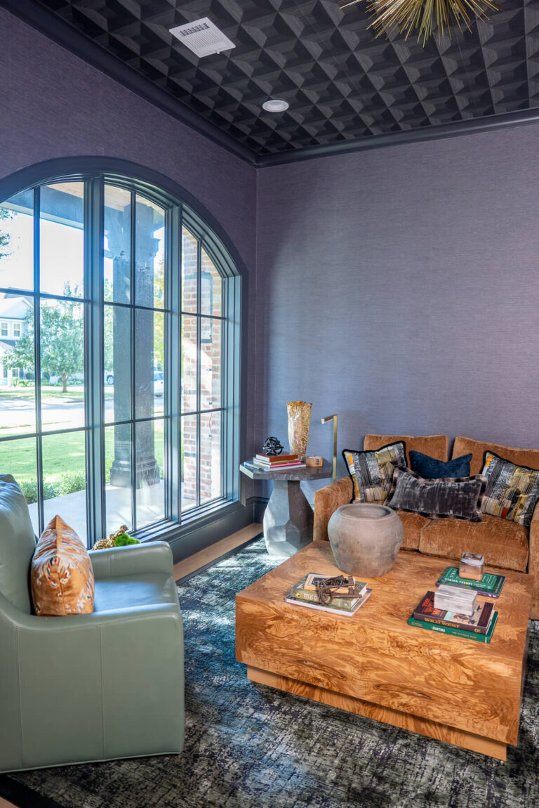 Brunswick sitting room with arched window and custom built-ins in Midway Hollow home
