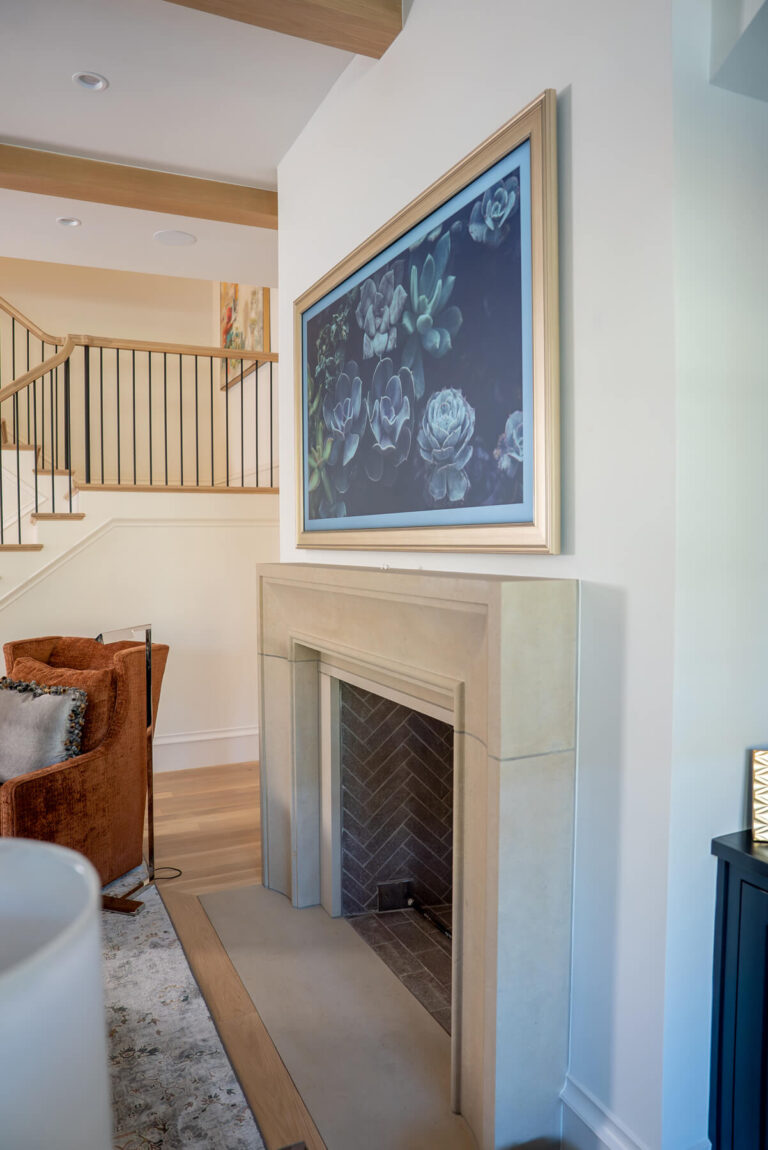 Brunswick living room with modern fireplace and staircase in transitional Dallas home