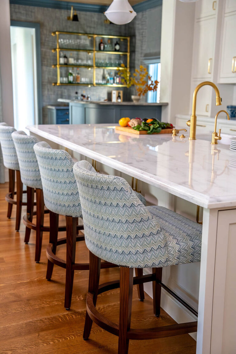 Custom island seating with upholstered bar stools in Dallas kitchen