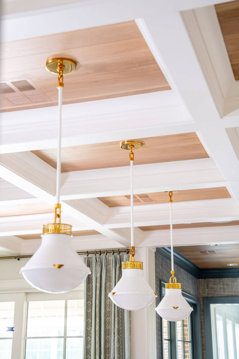 Coffered ceiling detail with brass pendant lighting in Dallas custom home
