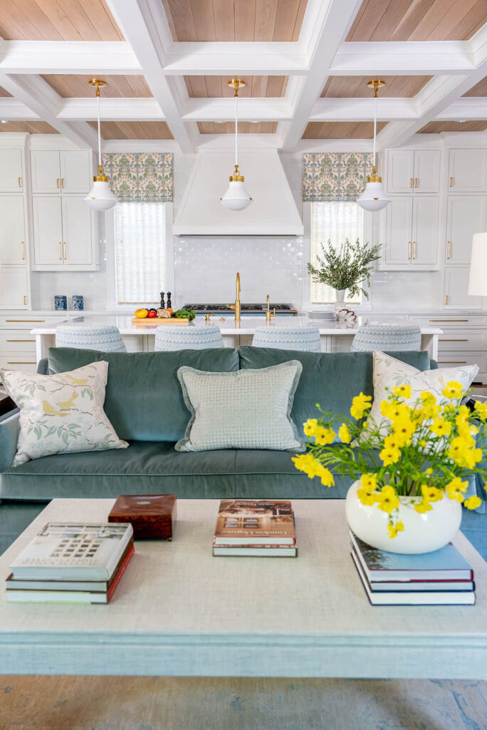 Custom living room with teal sofa and fireplace in Bryn Mawr project