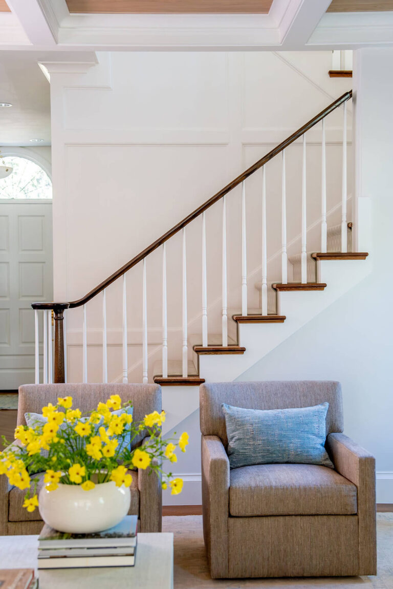 Wood staircase with white railing in Bryn Mawr custom home
