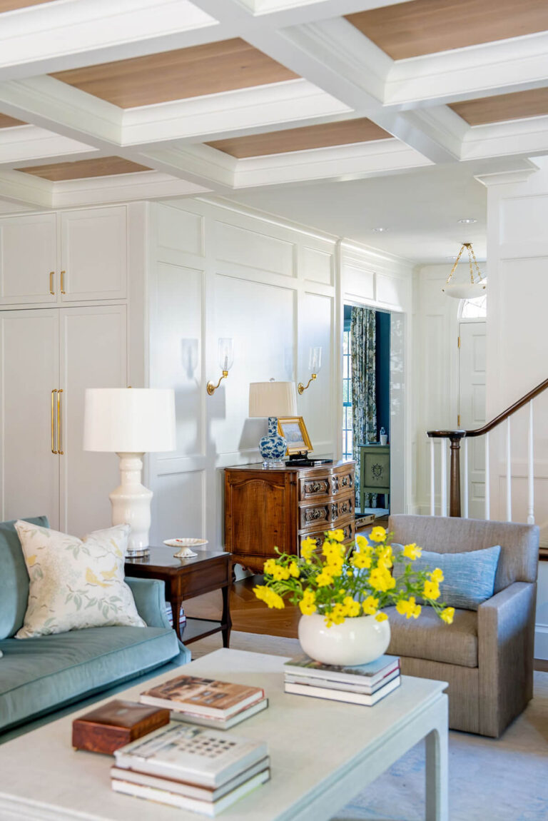 Classic living room with blue accents and brass lighting in Dallas home