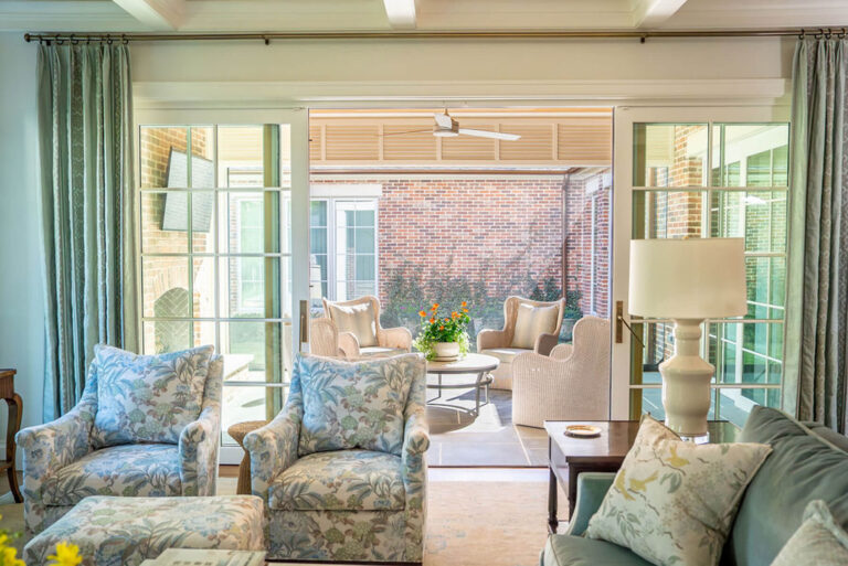 Indoor to outdoor transition to covered brick patio in Bryn Mawr home