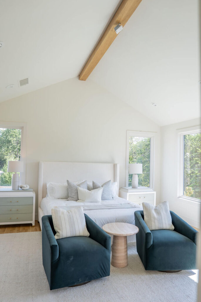 Lyre Lane primary bedroom with vaulted ceiling and large windows in Dallas custom home